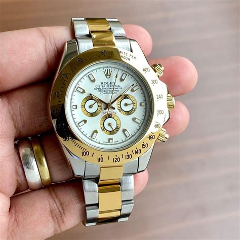 gold and silver rolex watch studded